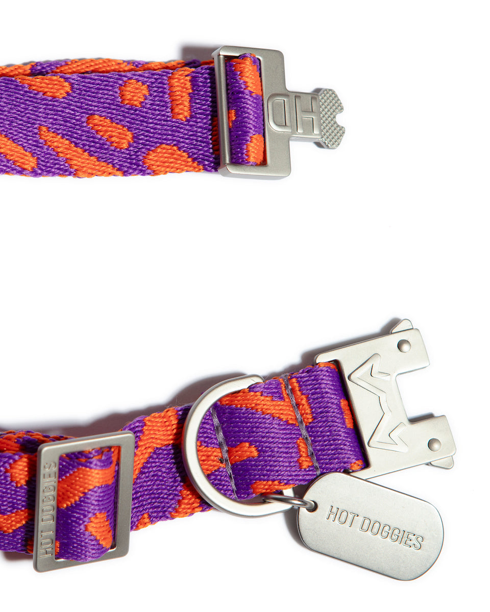 Detailed view of metal hardware on Hot Doggies pink wave patterned recycled polyester collar, combining strength and style.