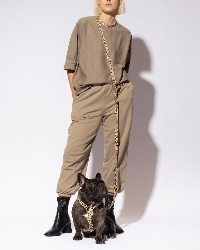 Hot Doggies Hands Free Leash Coco Noir – eco-friendly beige and black dog leash modeled with French Bulldog and fashion model,