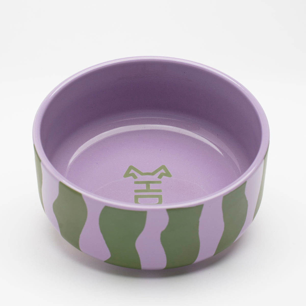 Front view of Hot Doggies Groove Stripes ceramic bowl with bold green and purple stripe design, dishwasher-safe, sturdy, ideal for serving food or water for small and medium dogs.