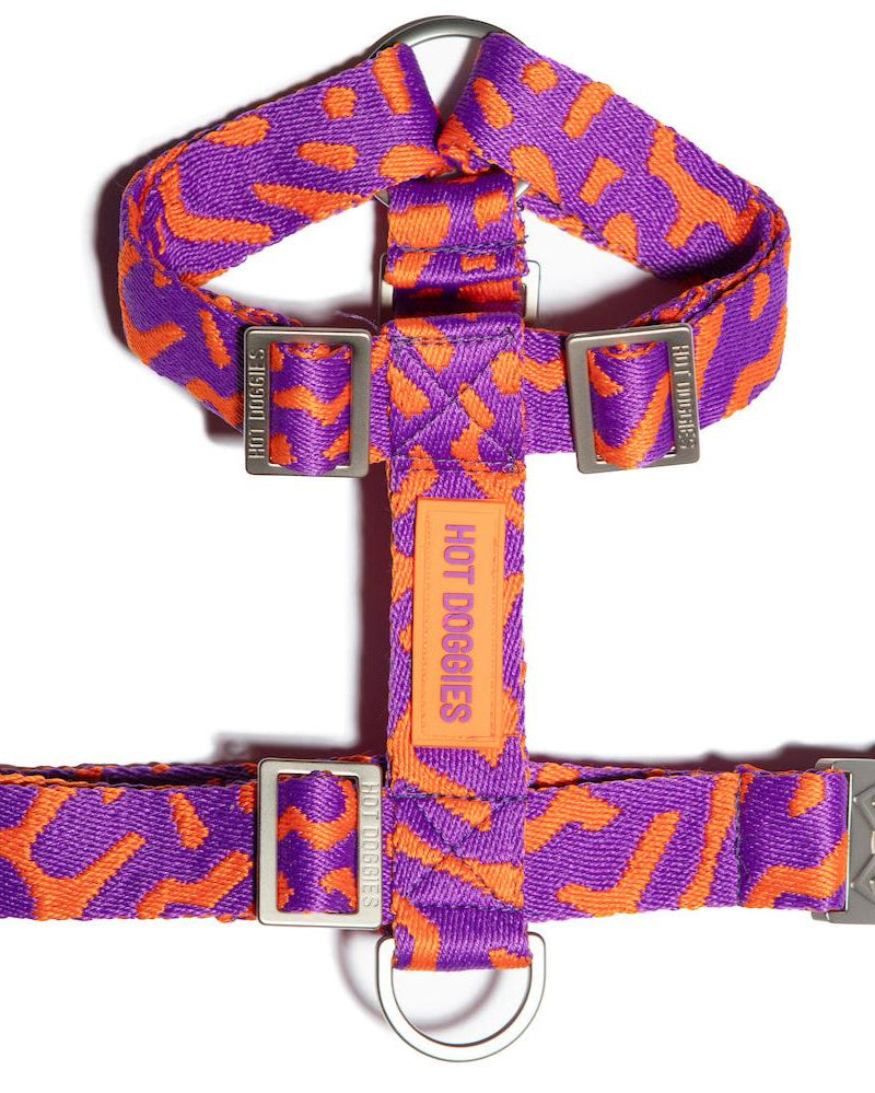 Flat-lay of the Hot Doggies Coco Noir Harness featuring a sleek, modern purple and orange design.