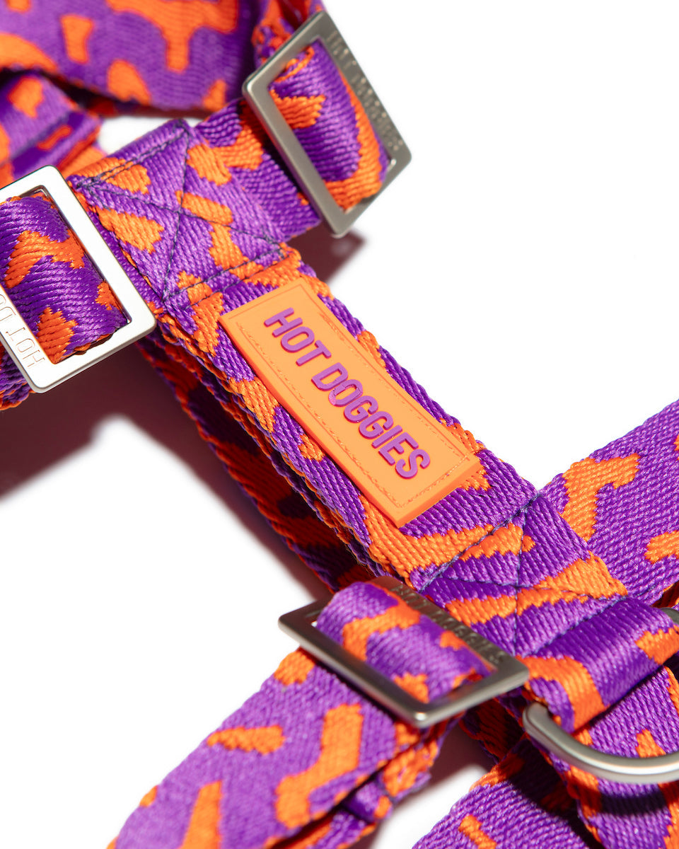 Flat-lay side of the Hot Doggies Coco Noir Harness featuring a sleek, modern purple and orange design.