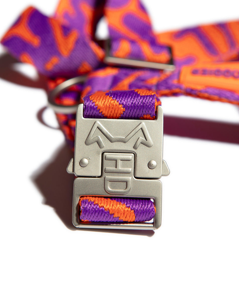 the Hot Doggies Coco Noir Harness featuring a metal hardwear modern purple and orange design.