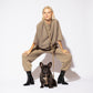 Hot Doggies Hands Free Leash Coco Noir – eco-friendly beige and black dog leash modeled with French Bulldog and fashion model, stylish hands-free dog walking gear.