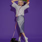 Hot Doggies Hands Free Dog Leash in Lily Coral – adjustable and eco-friendly, styled with fashion model holding flowers and black dog on vibrant purple background, perfect for dogs up to 22kg.