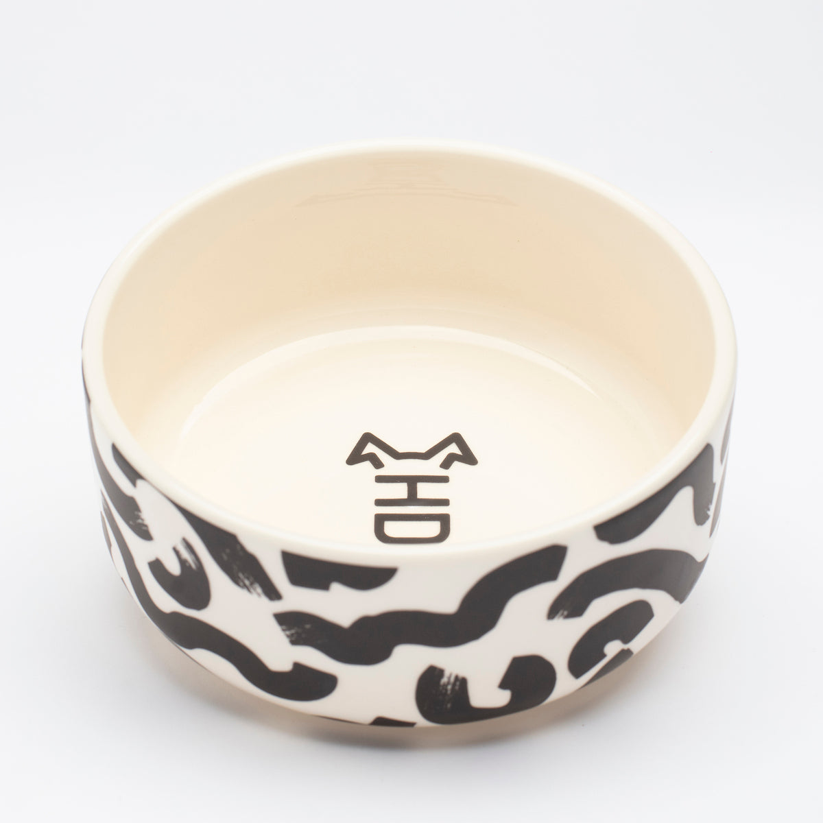 Side view of Hot Doggies Monochrome Ceramic Bowl with abstract black-and-white pattern - dog-friendly design for small and medium dogs - easy to clean and durable.