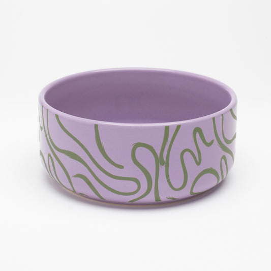 Abstract Lines Ceramic Bowl - green and purple, featuring vibrant abstract green lines on a purple ceramic base. Perfect for small and medium pets, this modern, minimalist design adds style to any mealtime.