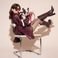 Woman in a purple outfit sitting on a chair with a dog wearing BONNY PLUM CLASSIC LEASH.