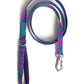 Dog leash with purple and teal pattern on a white background.