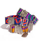 Colorful dog collar with metallic buckle and tags on a white background