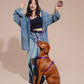 Woman in a denim outfit with a dog with HANDS-FREE LEASH ROCKY ELECTRIC on a beige background.
