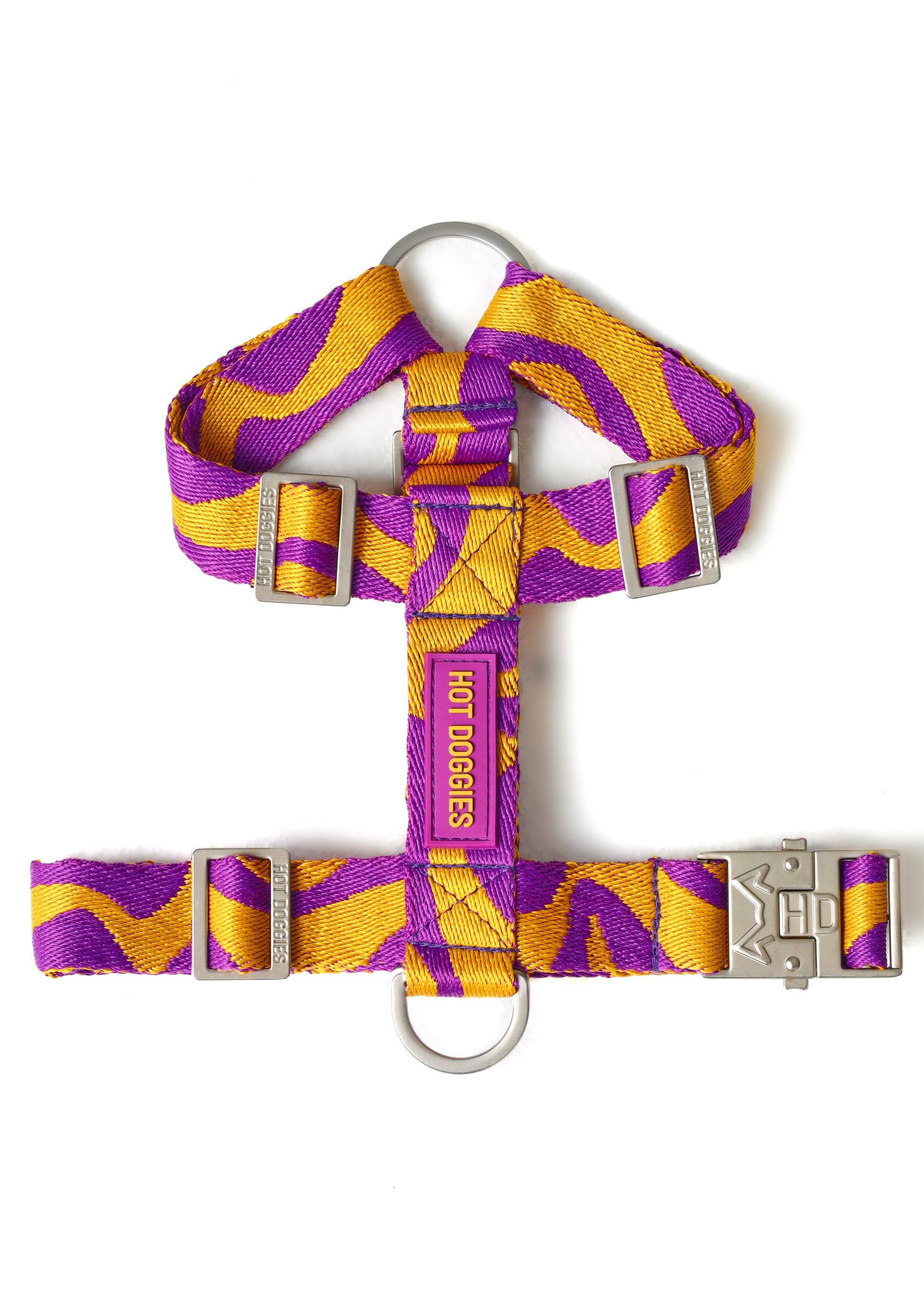 Dog harness with purple and yellow pattern on a white background