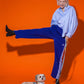Hot Doggies Classic Leash in Blue/Lime Geometric Lines, shown with a playful model and dog, highlighting its bold design and comfortable padded handle.