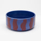 Side view of Hot Doggies Fusion Ceramic Bowl - blue and red stripes - durable, dishwasher-safe design for small and medium dogs