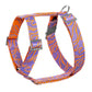 Dog harness with purple and orange pattern on a white background