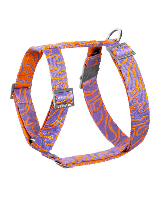 Dog harness with purple and orange pattern on a white background