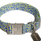 Flat lay image of a woven high quality collar with a blue and lime geometric pattern, crafted from recycled polyester.