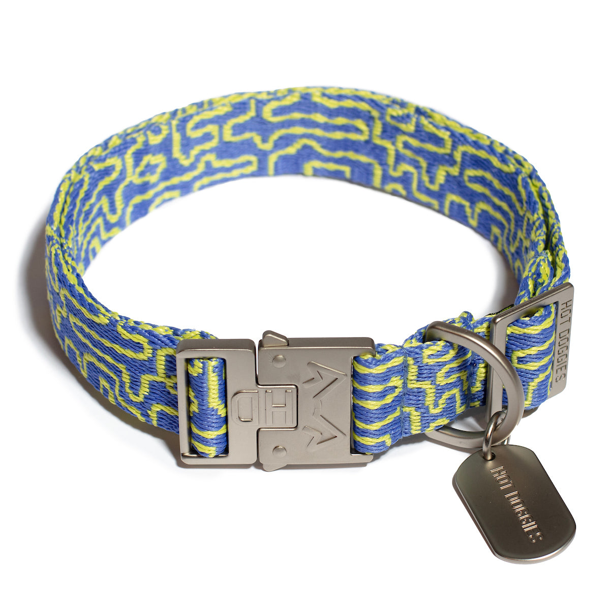 Flat lay image of a woven collar with a blue and lime geometric pattern, crafted from recycled polyester.