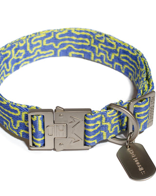 Flat lay image of a woven high quality collar with a blue and lime geometric pattern, crafted from recycled polyester.
