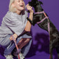Female model giving a treat to her dog, both wearing the Lily Coral Doodle Pattern Harness, showcasing comfort and style.