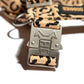 Metal hardwear of the Hot Doggies Coco Noir Harness with bold beige and black pattern showcasing its premium design and high quality.