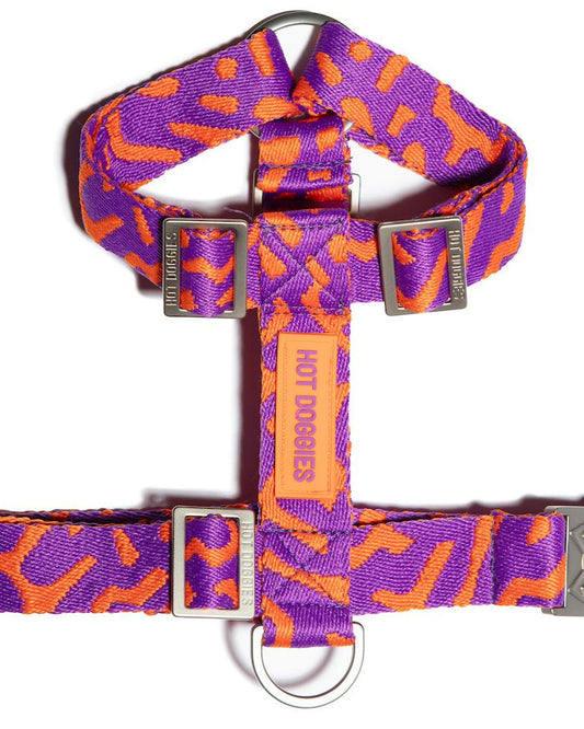 Flat-lay of the Hot Doggies Coco Noir Harness featuring a sleek, modern purple and orange design.

