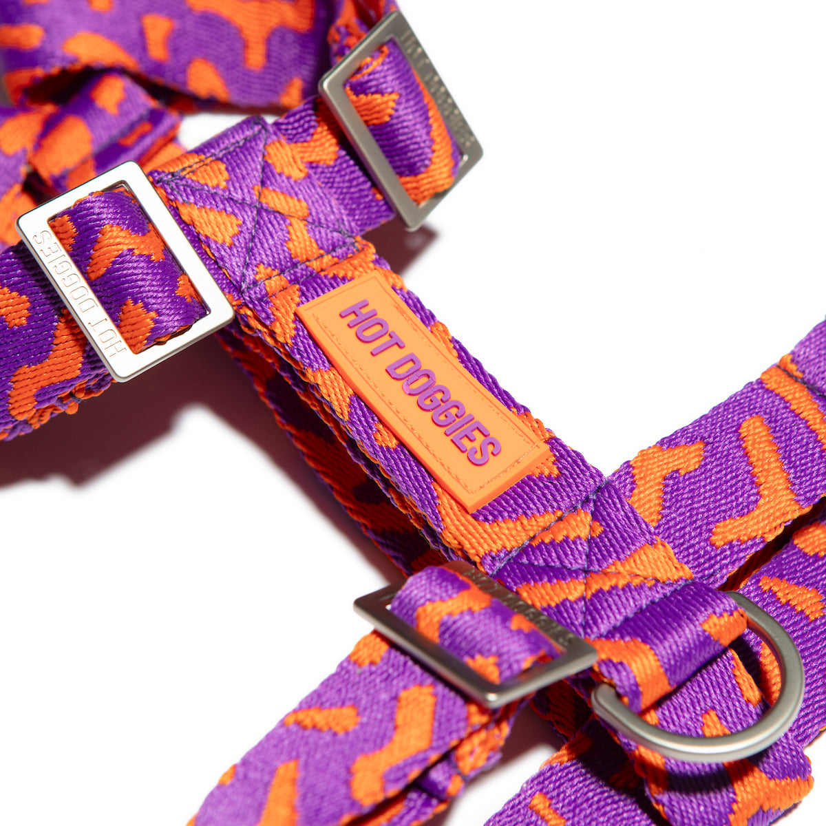 Flat-lay side of the Hot Doggies Coco Noir Harness featuring a sleek, modern purple and orange design.