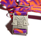 the Hot Doggies Coco Noir Harness featuring a metal hardwear modern purple and orange design.